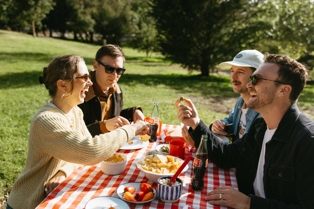 seed oil free chips being eaten by a group of friends in an outdoor setting.